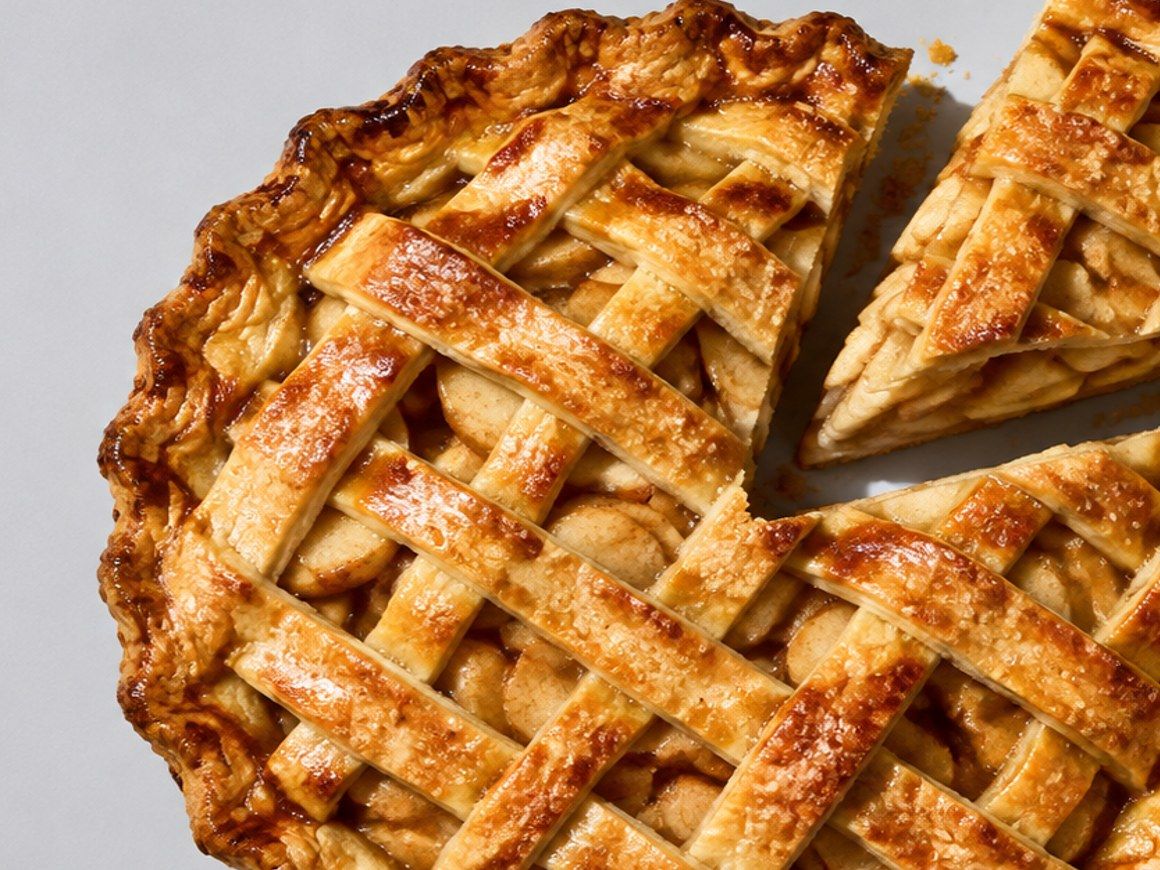 Close-up of the golden woven lattice on top of an apple pie